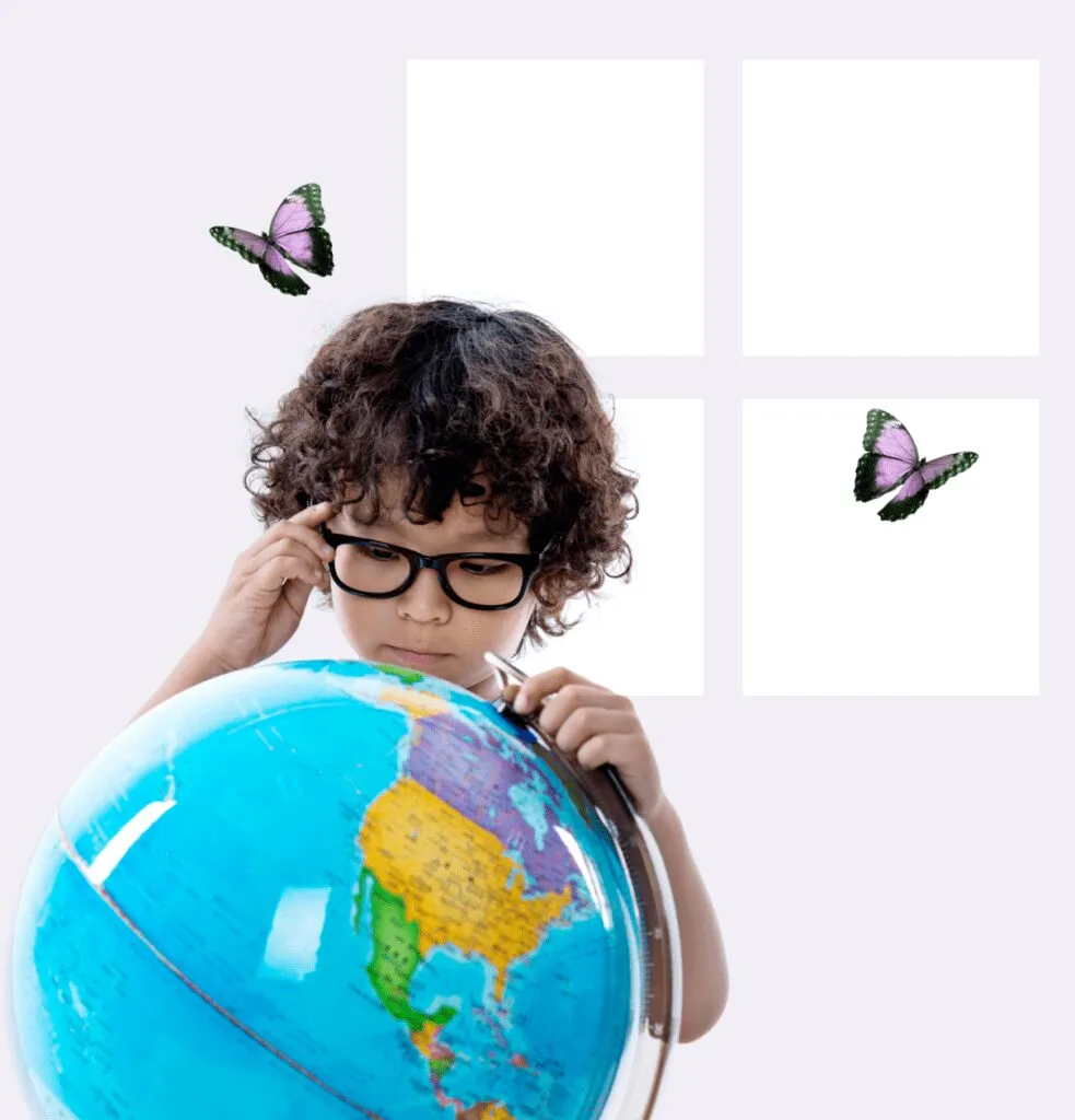boy with glasses looking at a globe